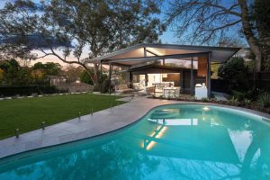 shows pool and outdoor entertaining area